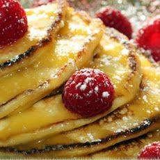 Lemon ricotta pancakes with lemon curd and fresh raspberries