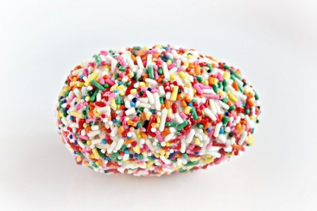 Rice Krispie eggs dipped in chocolate and sprinkles  