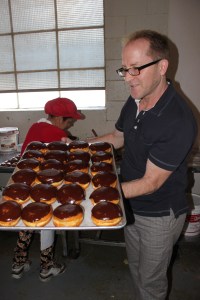 Ta-da! Top Pot co-founder Mark shares his fresh chocolate, creme-filled doughnuts