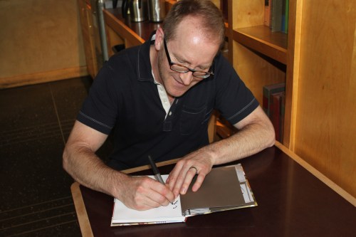 Autographing our Top Pot Doughnuts cookbook