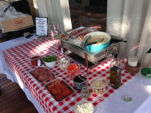 Backyard pizza party toppings bar