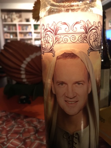 Our Peyton Manning prayer candle. Worked spectacularly this year! 